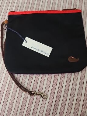 Dooney & Bourke Black Wristlet with Red Trim and Brown Strap and Purple Back